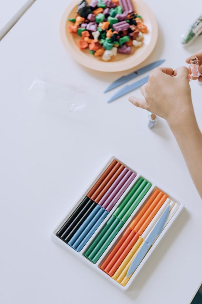 Child Playing with Colourful Plasticine